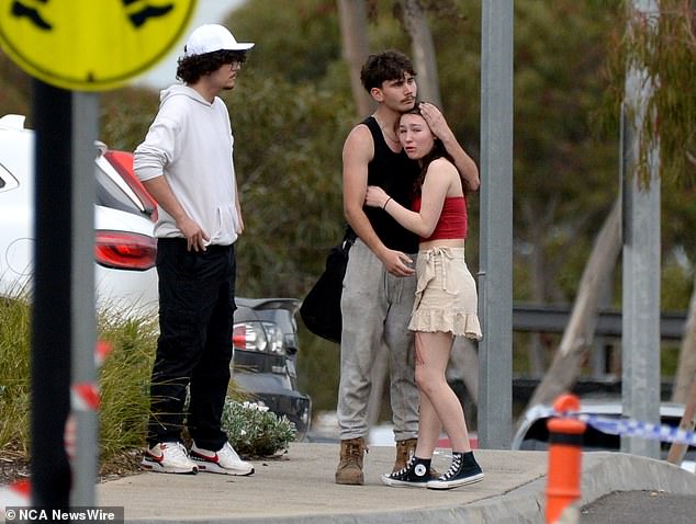 Oscar was allegedly stabbed 'multiple times' outside La Porchetta, in front of shocked bystanders. Witnesses can be seen in the photo consoling each other