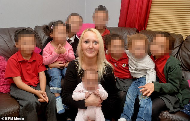 Marie Buchan, also known as 'British care queen', pictured with her eight children