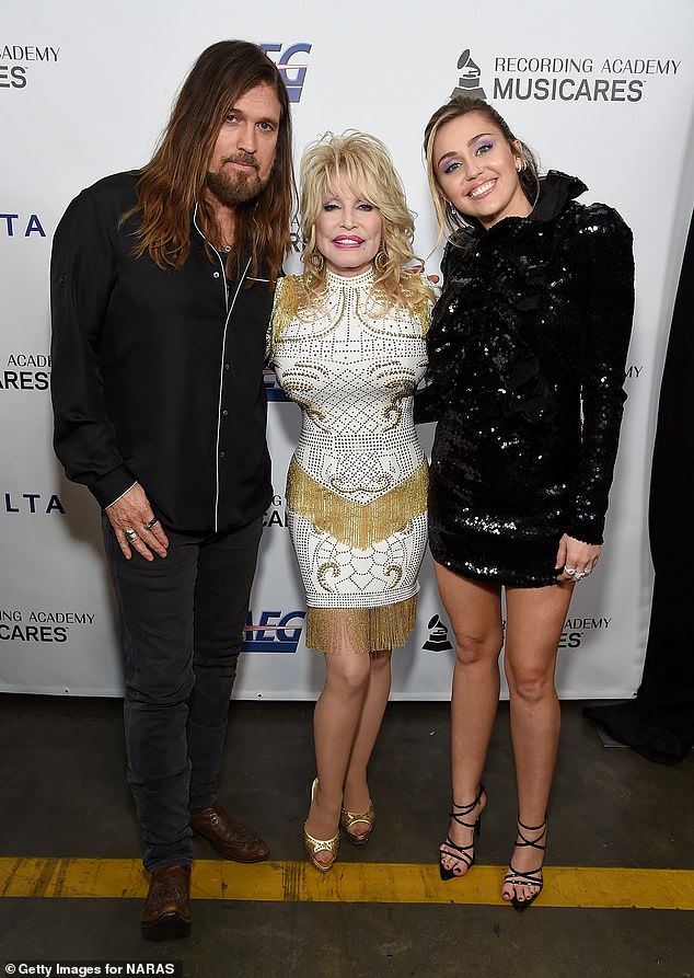 Both Dolly and Miley have strong ties to Tennessee and have worked together several times over the years; Miley's father Billy Ray, Dolly and Miley seen in February 2019