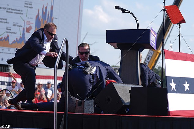 The bipartisan Senate investigation — released today — concluded that the failures leading up to the meeting were “foreseeable, preventable, and directly related to the events leading up to the assassination attempt that day.” Pictured: Secret Service agents gather to slam Republican presidential candidate former President Donald Trump at a campaign rally, July 13, 2024