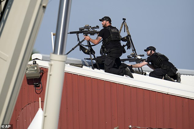 Police snipers return fire after shots were fired while Republican presidential candidate and former President Donald Trump spoke at a campaign rally in Butler, Pennsylvania, on July 13