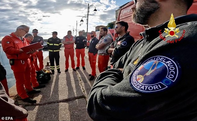 Divers prepare to conduct inspections of the Bayesian wreck at Porticello on August 23