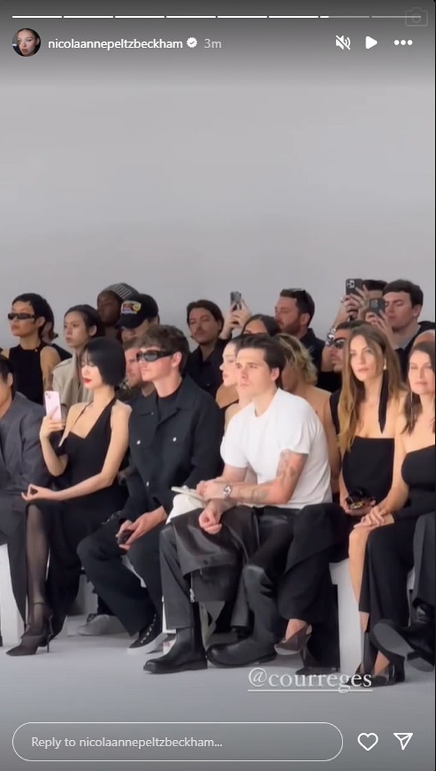 Nicola shared a photo of the couple sitting front row for the fashion show