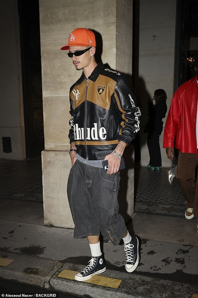 Romeo Beckham made a stylish impression in a black leather Rhude X Lamborghini jacket on Tuesday as he was photographed out on the town