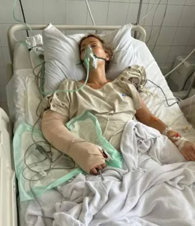 Charlene (pictured in hospital) received multiple blood transfusions as doctors tried to save her arm, but they stopped treatment after discovering her travel insurance company wouldn't pay her medical bills.