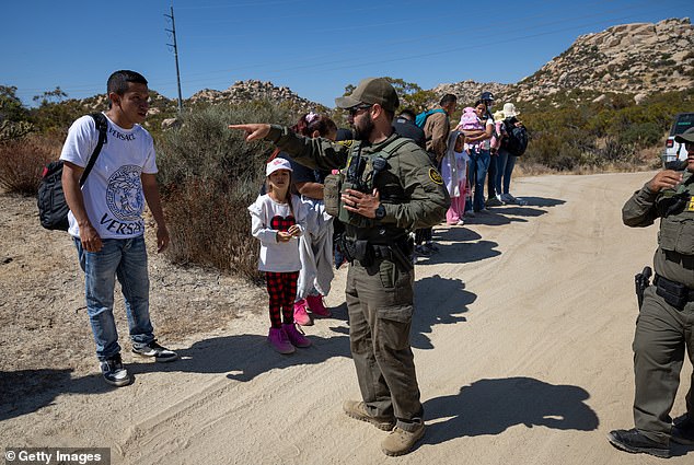 Border Patrol agents take asylum seekers into custody after they crossed a remote U.S.-Mexico border near Jacumba Hot Springs, California, on September 19, 2024.