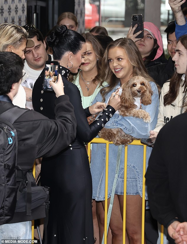 The sentiment wasn't lost on the Roar singer, who took the time to meet her human fans and give the puppy some special attention