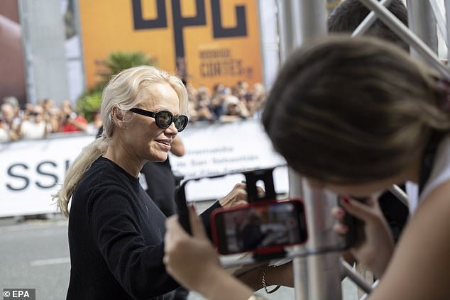 Pamela went makeup-free for the outing, with her golden locks in a ponytail