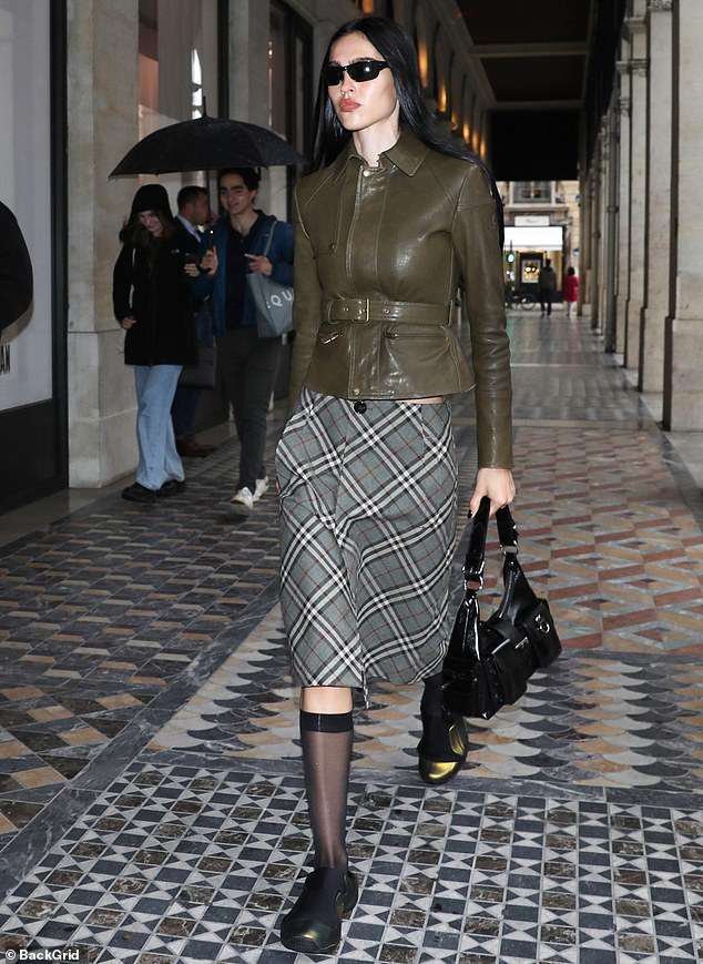 Wednesday's covered-up look was a far cry from what Amelia wore to Saint Laurent's Paris Fashion Week party on Tuesday