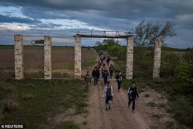 Migrants from China cross the border into Texas in April 2023