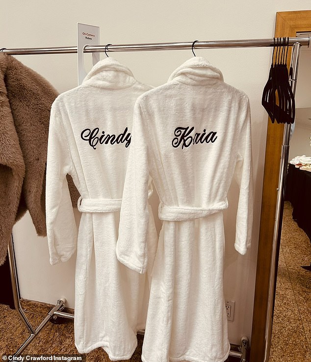 Crawford proudly posted a photo of matching white terrycloth robes, with her name and Kaia, who has followed in her footsteps, written on the back