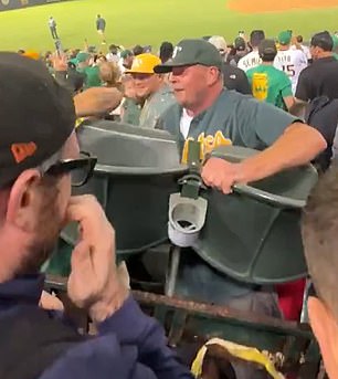 Fan carries chairs from the audience