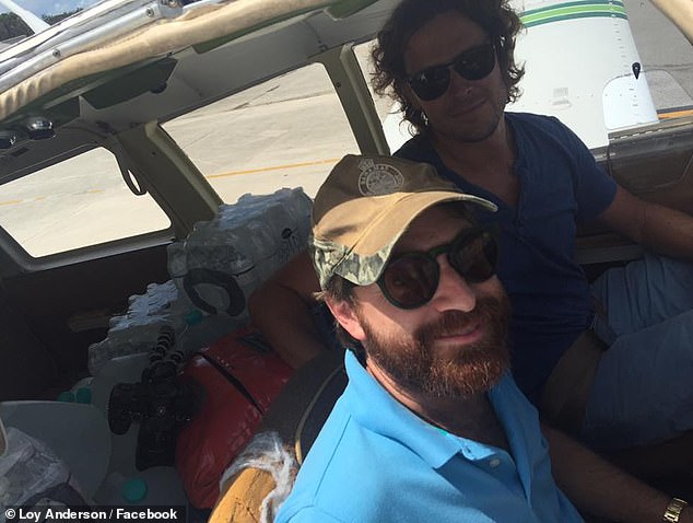 Loy on his plane with Kent to deliver water after Hurricane Irma in 2017