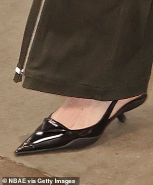 Clark wore black leather slingback pumps