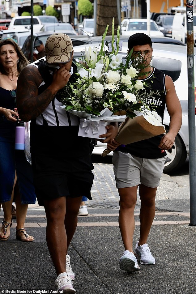 Heartbroken relatives returned to the scene of the shocking crime to leave flowers and pay their respects