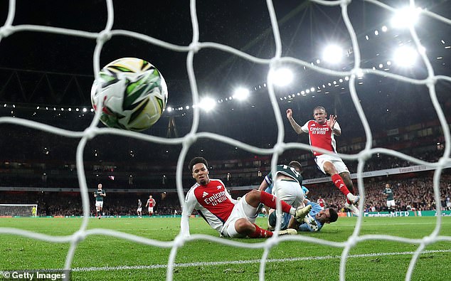 Nwaneri (centre) pictured immediately after scoring the first goal of his Arsenal career