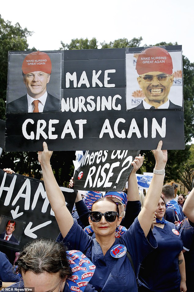 A sign (pictured) featured doctored photos of Mr Minns and New South Wales Finance Minister Daniel Mookhey wearing red Donald Trump-style caps with the message 'Make nursing great again'