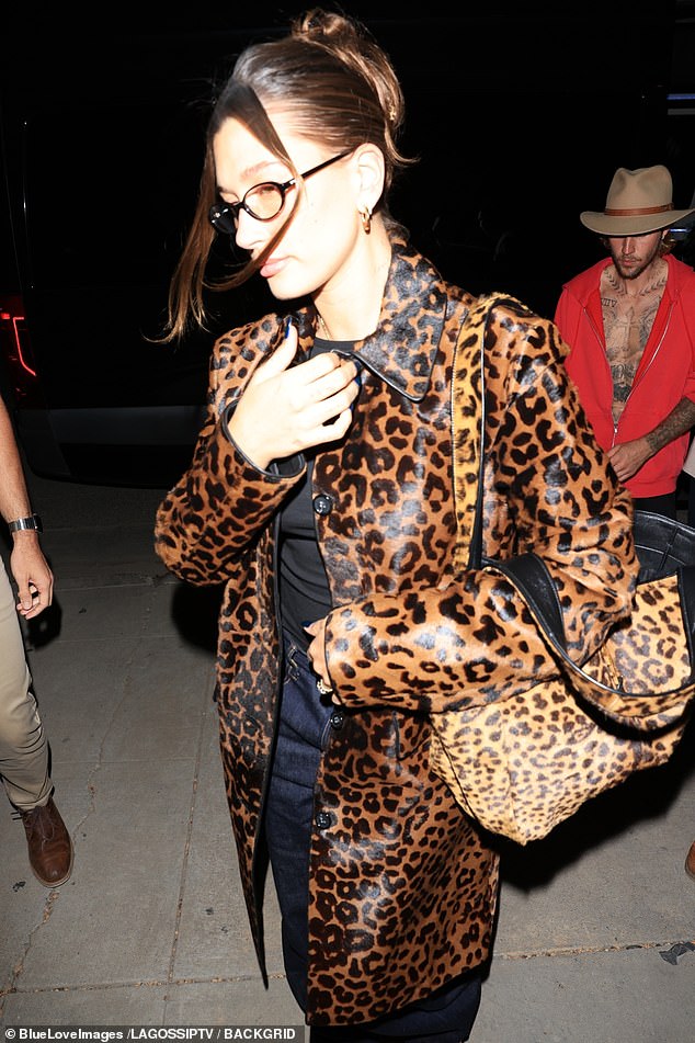 Meanwhile, Hailey wore a cheetah print jacket, matching cheetah bag and red sneakers