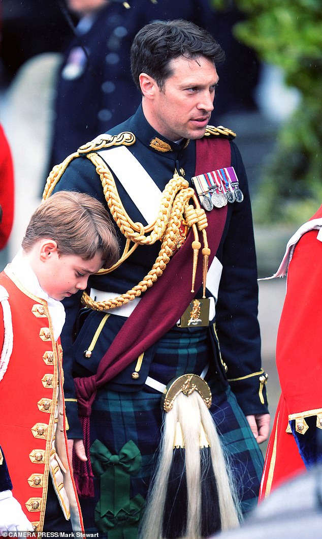 The army officer with Prince George at the King's coronation last year