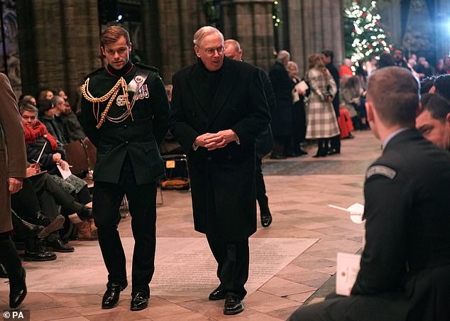 The kinsman of the 9th Lord Plunket arrives for a carol service with the Duke of Gloucester in December 2022