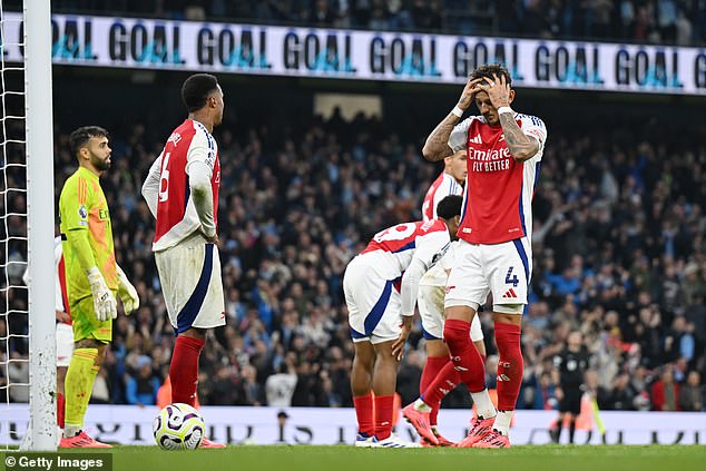 Arsenal's defenders looked dispirited after failing to secure victory over their title rivals