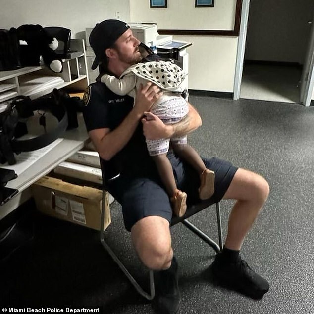 Shortly after the children were found, Miami Beach police posted a heartwarming photo of Officer Miller holding the two-year-old in his arms on their Instagram