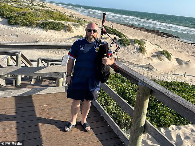 Darren is enjoying a better life in Australia and can now play the bagpipes on the beach (pictured) next to his four-bedroom home