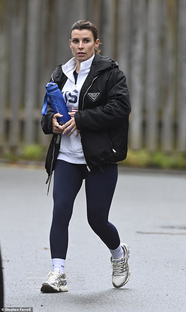 Coleen also wore a pair of tight-fitting navy leggings and a pair of white and silver trainers with socks