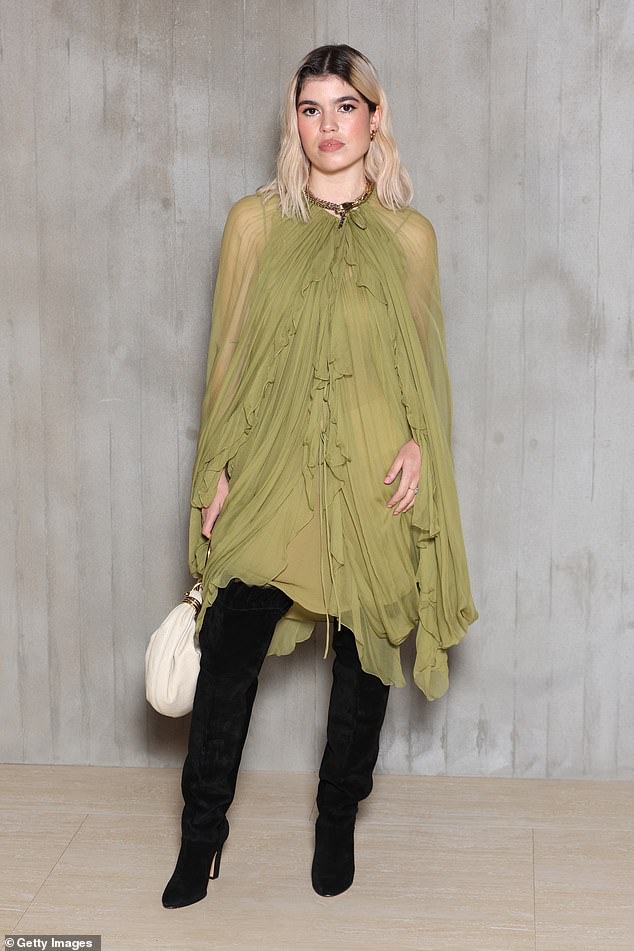 Meanwhile, Liam Gallagher's 26-year-old daughter Molly looked stunning in a breezy green mesh dress which she teamed with a pair of thigh-high black boots and a white handbag.