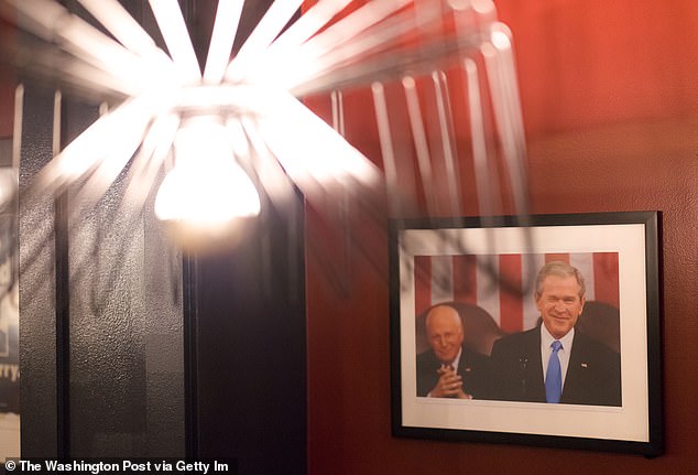 Framed portraits of presidents hang throughout the three-story bar