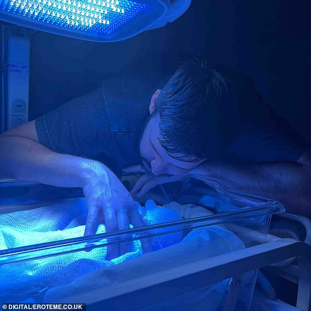 Another photo showed her son lying in a Babytherm while her boyfriend Scott watched over him.