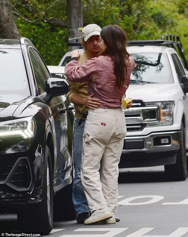 Jeremy looked smitten with his co-star as they embraced by her car