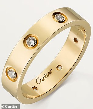 Buyers are rushing to Amazon to get their hands on a $9.99 stainless steel ring that looks just like Cartier's classic Love Ring (pictured)