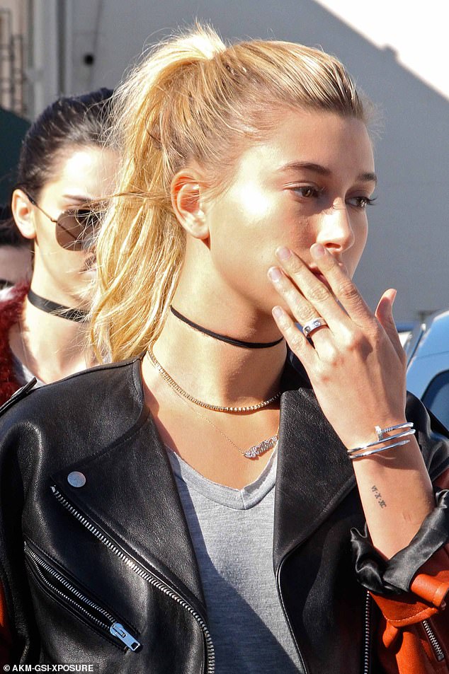 Hailey Bieber is pictured above in January 2016 wearing a silver Cartier Love ring paired with the design house's Juste un Clou bracelet