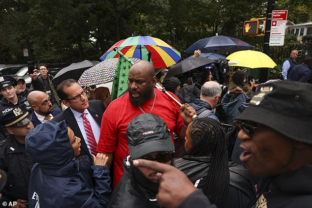 Another protester told the mayor to resign because he is 