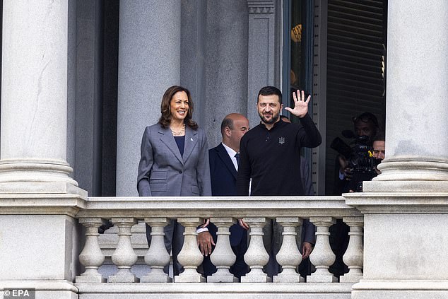 Vice President Kamala Harris and Ukrainian President Volodymyr Zelensky wave from the balcony of the Eisenhower Executive Office Building