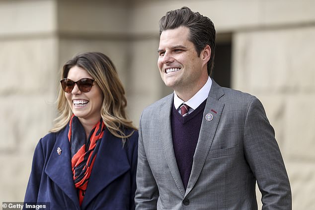 Gaetz walks with his fiancée Ginger Luckey before addressing a crowd in 2021. The two are now married