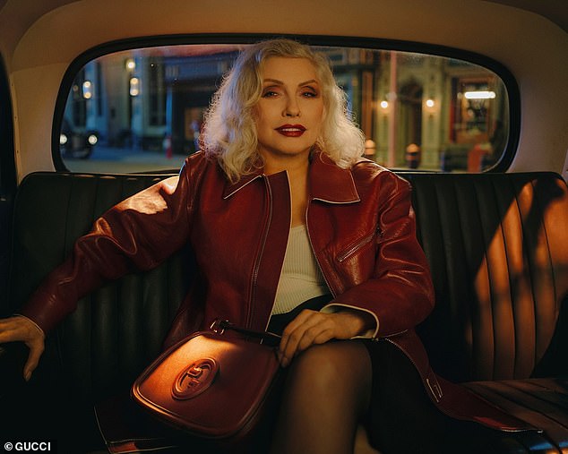 Photographer Nan Goldin also captured Debbie (born Angela Trimble) wearing an oxblood leather jacket selected by stylist Francesca Burns to match the $3,900 Gucci Blondie 'Small Top Handle Bag'