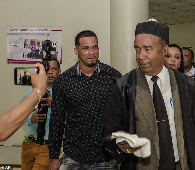 Franco (smiling) left the court in Puerto Plata last month with his lawyer Teodosio Jaquez (right)