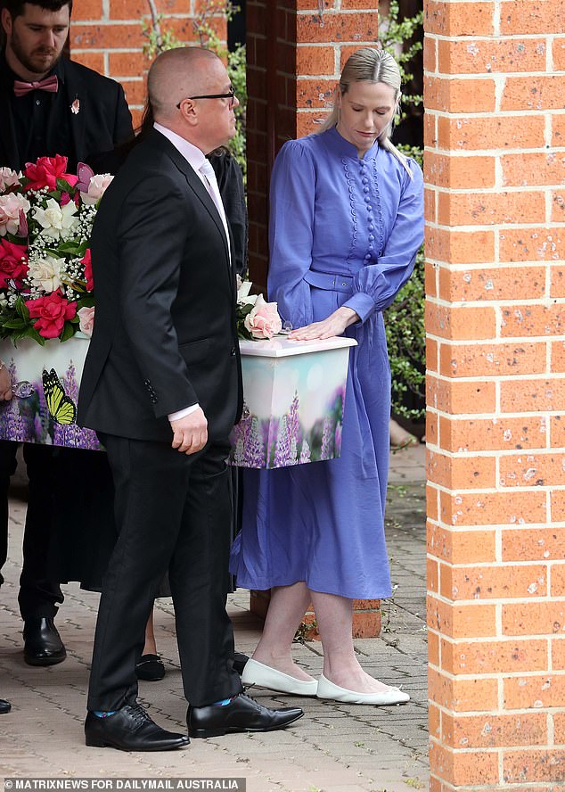 Charlotte's parents, Mat and Kelly, carried their daughter's coffin into the church (pictured)