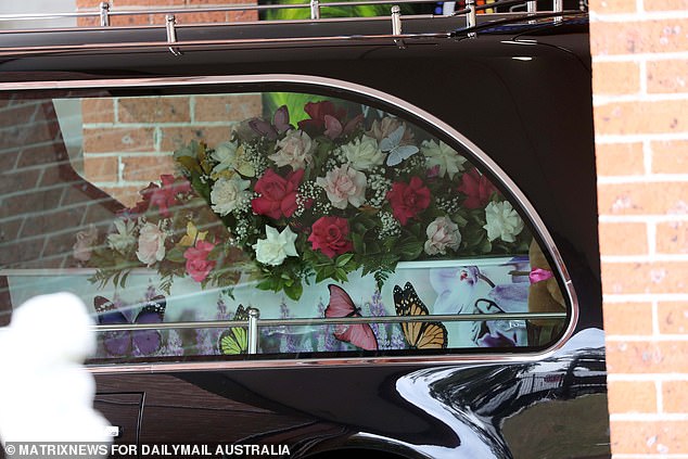 Charlotte O'Brien's coffin was covered in painted butterflies and lavender (pictured)