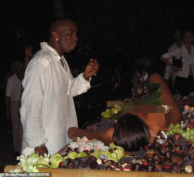 The footage shows Diddy, who was 34 at the time, enjoying a chocolate-covered strawberry from a naked woman, seen as the centerpiece of a dinner plate.