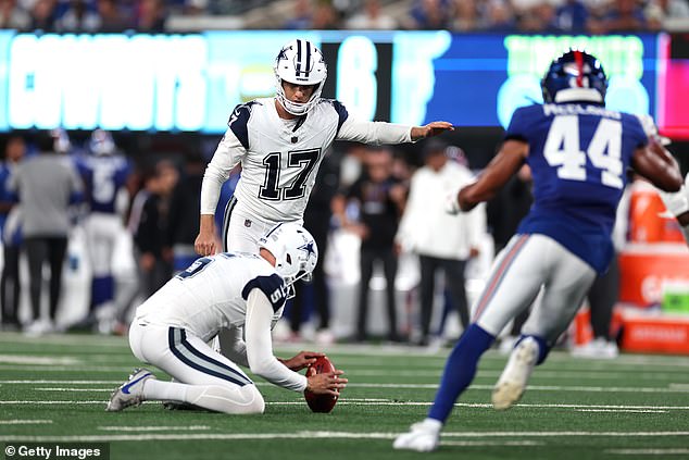 Brandon Aubrey #17 of the Dallas Cowboys scores an extra point during the first quarter