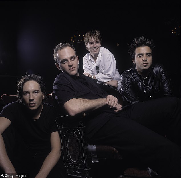 The 50-year-old singer has revealed the band will continue in two forms after being embroiled in a bitter legal dispute with former bandmates. Pictured from left: Tim Wild, Tim Watson, Daniel Hall and Jason Singh