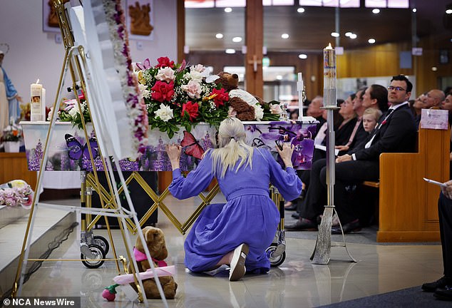 Charlotte's mother, Kelly, kissed her daughter's casket during the service on Friday