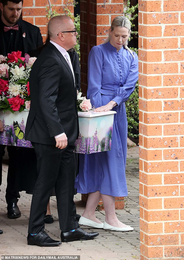 Charlotte's parents, Mat and Kelly, carried their daughter's coffin into the church (pictured)