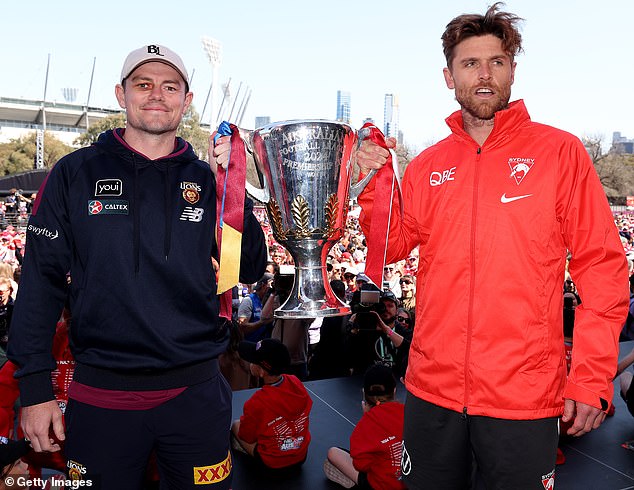 It follows Lachie Neale who made sure he kept his hand on the premiership trophy a little longer than his counterpart Dane Rampe (pictured, during Friday's grand final parade)