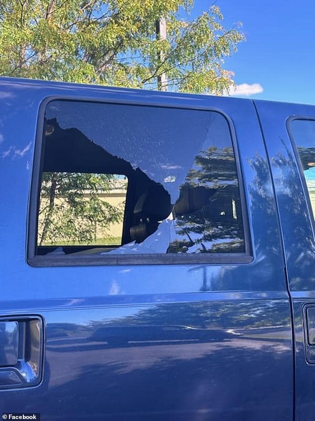 Vehicles were parked on the side of the highway with shattered windows and visible bullet holes