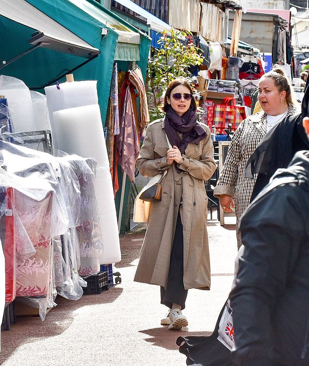 The Netflix star completed the look with a burgundy scarf and sunglasses and made her way through the market before purchasing a book from Special Rider Books & Records