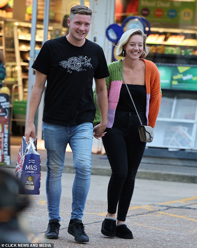 Kelsey looked relaxed and happy as she beamed at Will, who was filling up his car while she chatted with him at the pump.